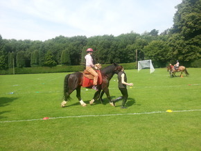 Half_width_natalie_mason_riding_a_horse